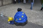 A protester wrapped in a European flag with a construction helmet near her before the protest against Foreign Influence Act. Young people have been organizing demonstrations for 14 days. They have experience with the police, who intervened harshly in their protests against using rubber bullets, gas and water cannons. Dozens of protestors ended up in hospitals.